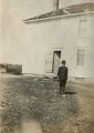 Amy Golding standing at the rear of our home dressed in her brother's Spanish American War uniform - circa 1900.