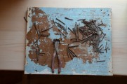 Straightening antique square nails to use for pantry shelves.