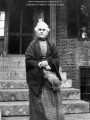 Title: Rebecca Randall Usher (1821-1912) on the steps of her brick house in Hollis