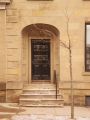 The front entrance of the 1827 buff colored 'brownstone' on Coburg Street.